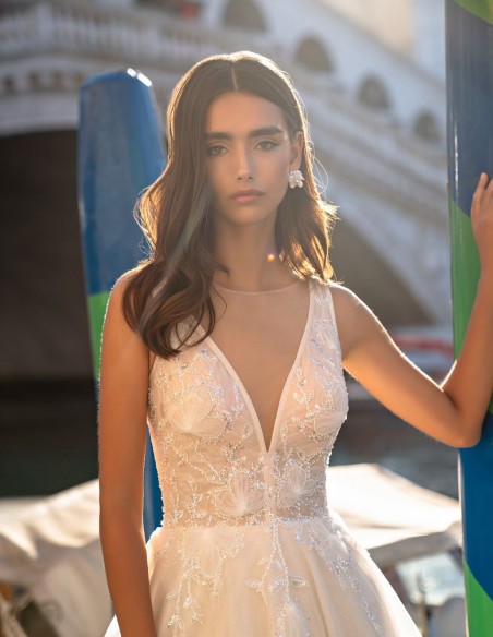 Ivory long wedding dress with V-neckline and beaded bodice