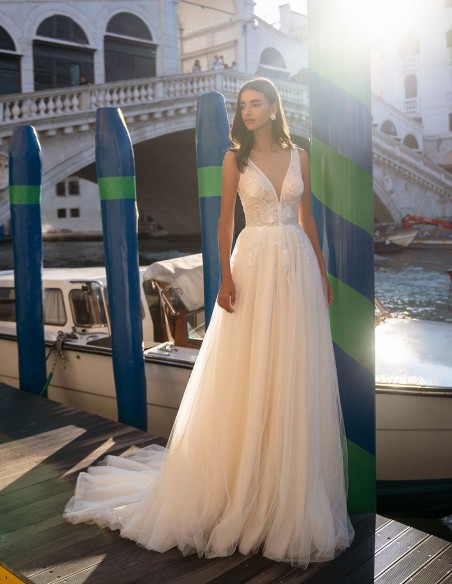 Ivory long wedding dress with V-neckline and beaded bodice