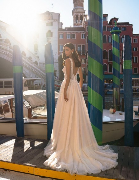 Ivory long wedding dress with V-neckline and beaded bodice