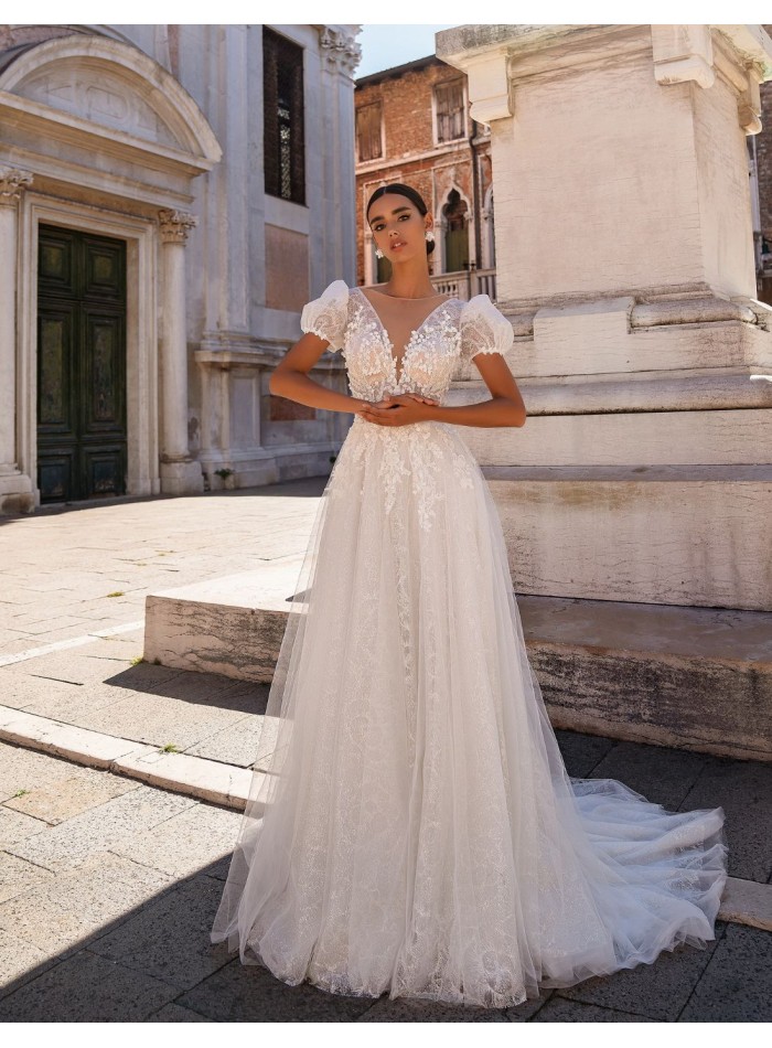 Long wedding dress in floral embroidered tulle...