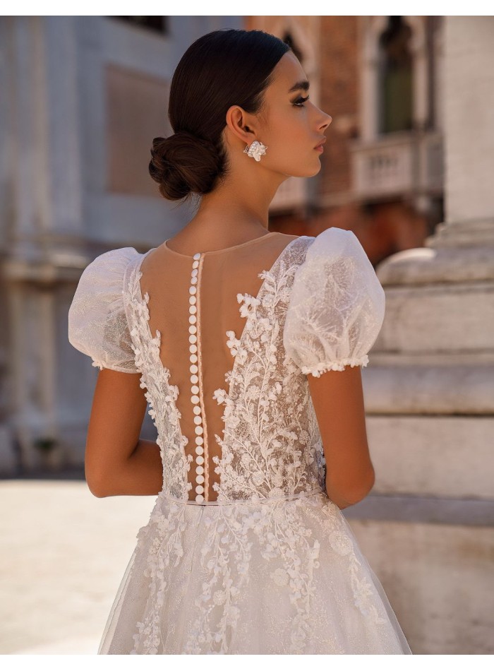 Long wedding dress in floral embroidered tulle...