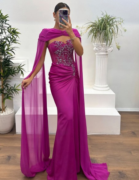 Evening dress with rhinestone neckline, draped detail and cape