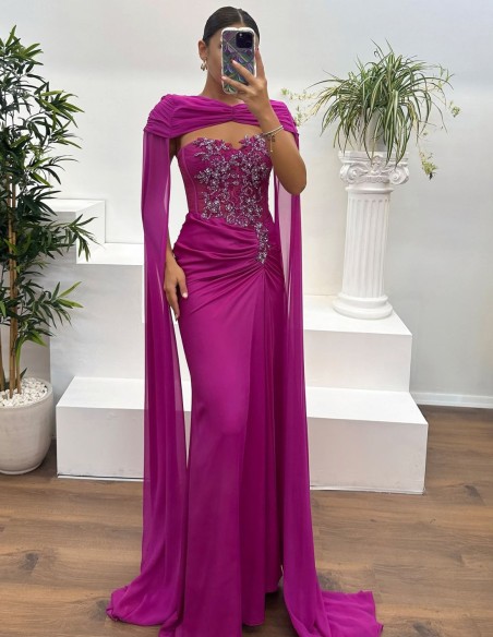 Evening dress with rhinestone neckline, draped detail and cape